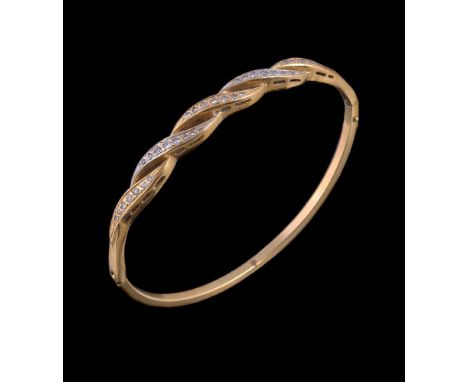 A diamond hinged bangle, the pierced rope twist style panel set with graduating brilliant cut diamonds, approximately 0.50 ca
