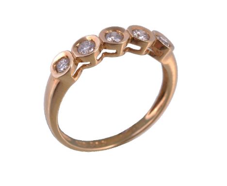 An 18 carat gold diamond five stone ring, the brilliant cut diamonds within a polished gold coloured setting, approximately 0