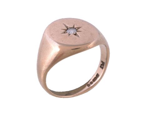 A 9 carat gold diamond signet ring, set with a brilliant cut diamond, estimated to weigh 0.08 carats, in a star setting, stam