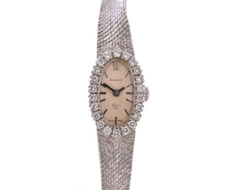 Bulova, a lady's 14 carat white gold and diamond cocktail watch, manual wind movement, 23 jewels, cal. 5BD, silvered dial, ba