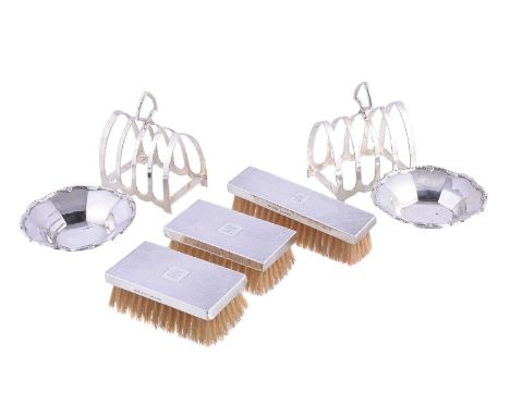 Seven silver and silver mounted items, comprising: a pair of four division toast racks by Viners, Sheffield 1932-33, 9.5cm (3
