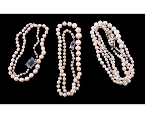 A cultured pearl necklace, the single strand of graduated cultured pearls, measuring 3mm to 7mm, on a knotted string, to a bl