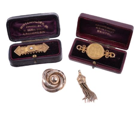 A late Victorian half pearl brooch, the half pearl in a star setting, on a beadwork panel, 4.3cm wide; a Sovereign brooch, th