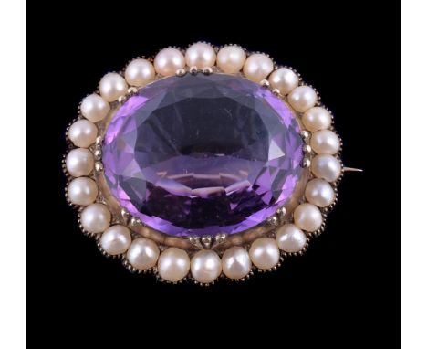 An Edwardian amethyst and half pearl brooch, the oval cut amethyst in a collet setting, within a surround of half pearls, 2.8