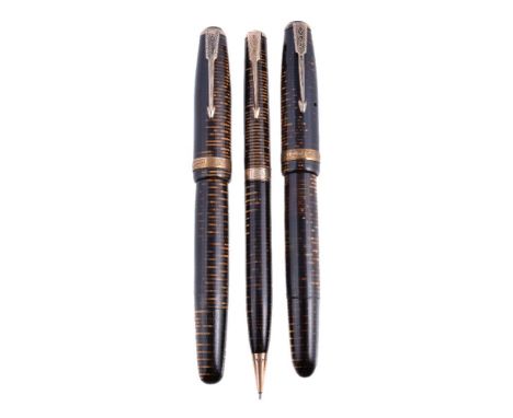 Parker, Vacumatic, a brown striated fountain pen, the cap with a gilt metal arrow clip and cap band, the nib stamped 14K, plu