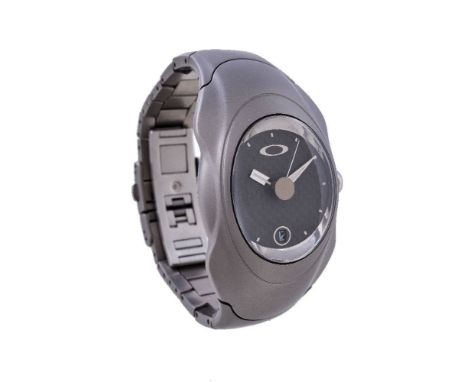 Oakley, Inertial Generator Time Bomb, a titanium wristwatch, automatic quartz movement, carbon fibre style dial, applied bato