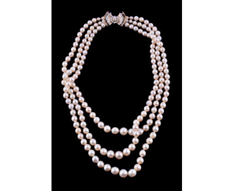 A three strand cultured pearl and diamond necklace, the three rows with graduating cultured pearls, to the bow clasp with lat