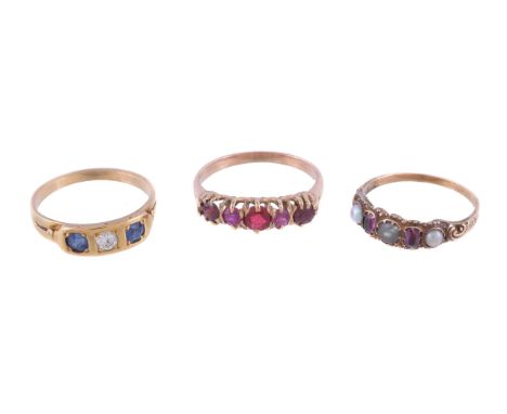 An Edwardian sapphire and diamond ring, the central brilliant cut diamond, estimated to weigh 0.13 carats, between two circul