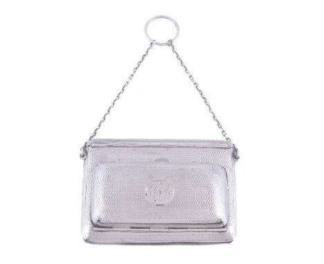 A silver rounded rectangular combination card case and purse, maker's mark D.BROs. (not traced), Birmingham 1911, engine turn