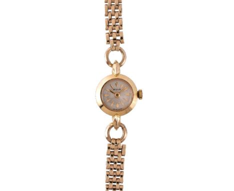 Avia, a lady's 18 carat gold wristwatch, no. 6050 2, Swiss manual wind movement, 17 jewels, silvered dial, applied dart marke