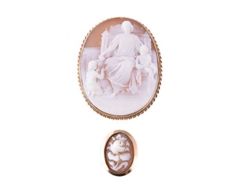 A shell cameo brooch, the oval panel carved with the Virgin Mary, Jesus and St. John the Baptist, in a gold coloured ropetwis