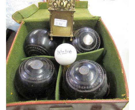 Cased set of wooden bowls, together with a small reproduction lantern clock 