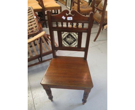 Victorian hall chair with tile inset back, an Arts & Crafts open bookcase and an oval wall mirror 