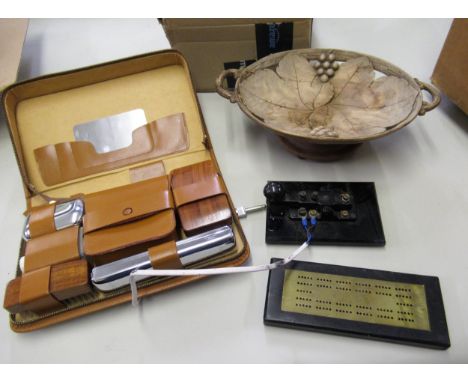Wooden musical two handled dish, Morse code machine, brass cribbage board, and a cased vanity set 