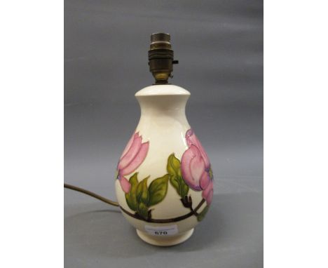 Late 20th Century Moorcroft table lamp with floral tubeline decoration on a cream ground, 21cms highVery minor crazing, other