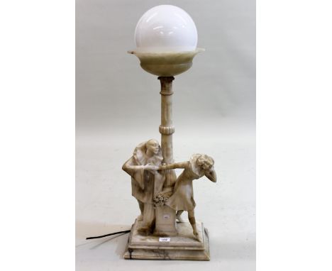 Early 20th Century carved alabaster table lamp, the opaque glass ball form shade above a tulip carved column support with fig