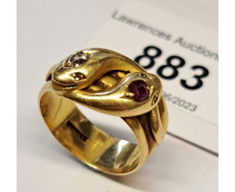 18ct Gold double serpent head ring, set a ruby and diamond, size O, 7.8gLots of surface wear from general use. No other noted