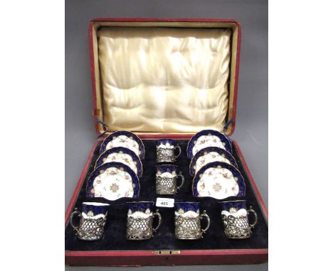 Cased set of six Coalport porcelain coffee cans and saucers with silver holdersPorcelain with very minor gilt loss. Box is qu