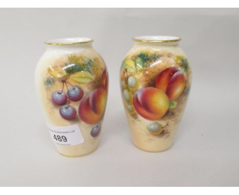 Pair of Royal Worcester vases decorated with fruit, signed by the artist Roberts, 10cms highBoth in good condition 