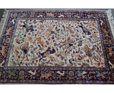 Modern Indo Persian rug with an all-over hunting design on an ivory ground with borders, 180cms x 120cms 