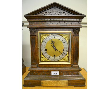 Late 19th Century oak cased bracket clock, the architectural case with brass dial, silvered chapter ring and Roman numerals, 