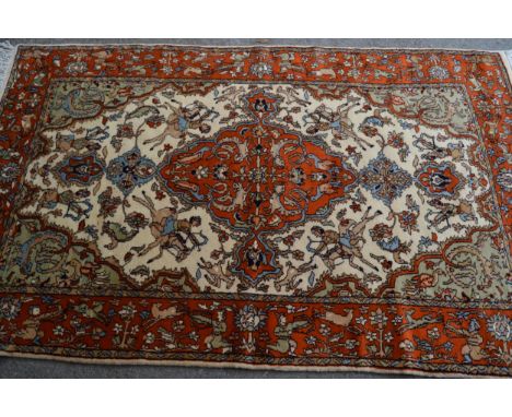 Indo Persian rug with a medallion and hunting design in shades of iron red and cream, 183cms x 122cms 