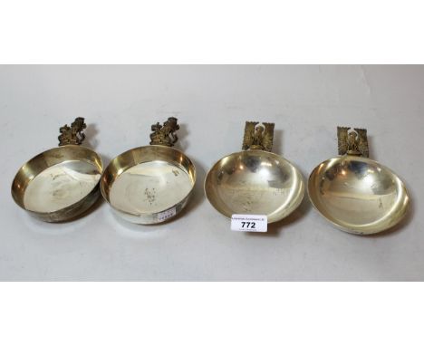 Pair of modern silver and silver gilt holy water scoops, the handles in the form of eagles with outstretched wings, together 
