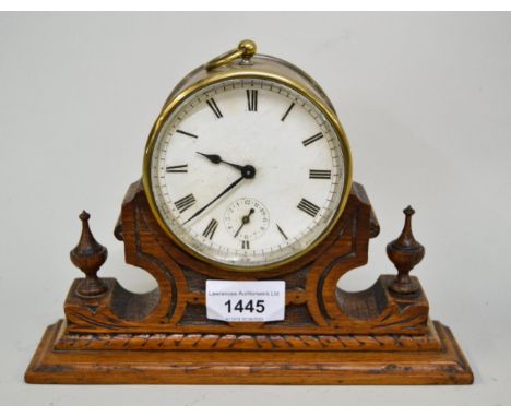 Small 19th Century brass cased drum clock, the enamel dial with Roman numerals and subsidiary seconds, 9.5cms diameter, on a 