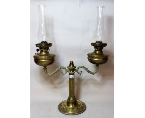 Late 19th / early 20th Century brass twin light oil lamp with glass chimneys, 68cms x 49cms 