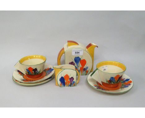 Clarice Cliff Bizarre Stamford shape teapot decorated with Crocus pattern, 12cms high together with a matching cream jug, two