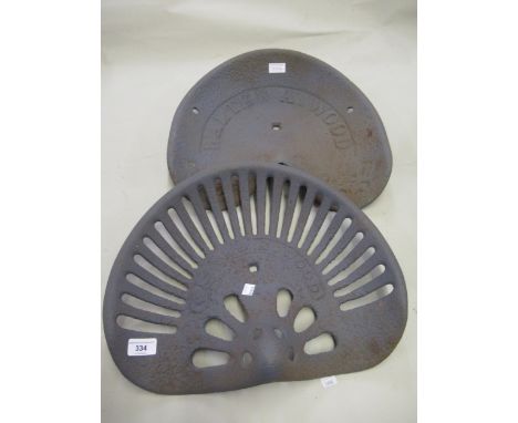 Two original early 20th Century cast iron tractor seats by Walter A. Wood, New York, USA 
