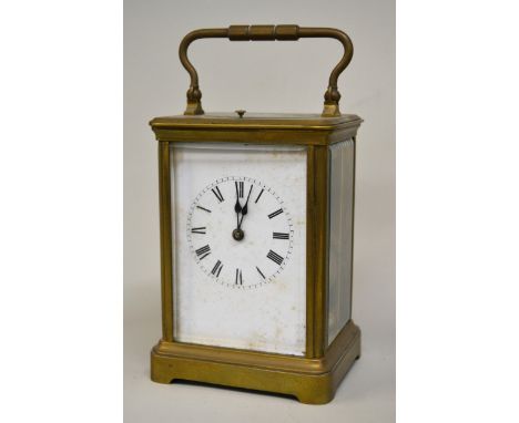 Brass cased carriage clock with enamel dial and Roman numerals, the two train movement striking on a gongIs in working order 
