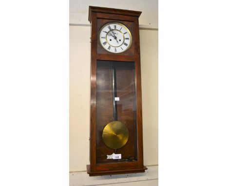 Early 20th Century walnut cased Vienna type wall clock, the rectangular case enclosing an enamel dial with Roman numerals and