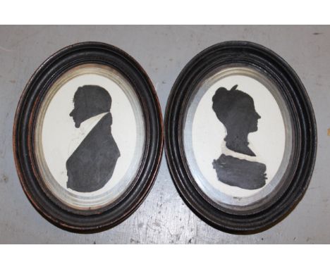Two pairs of 19th Century silhouette portraits of ladies and gentlemen, together with another silhouette portrait and two wat