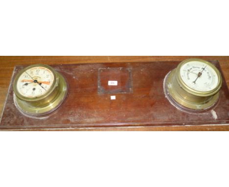 A wall mounted brass 'Union Castle Line' ship's clock and 'Rothesay Castle' ship's barometer