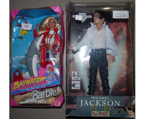 An originally boxed Michael Jackson musical figure; an originally boxed Baywatch Barbie Doll (box a.f.)