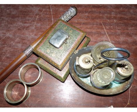 A swagger stick with white metal mounts; a silver Vesta case; 2 brass cigarette cases; a pair of napkin rings