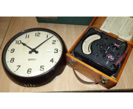A gent's circular industrial slave clock in Bakelite case, a Smith's mantle clock; a boxed voltammeter in wooden box (model '