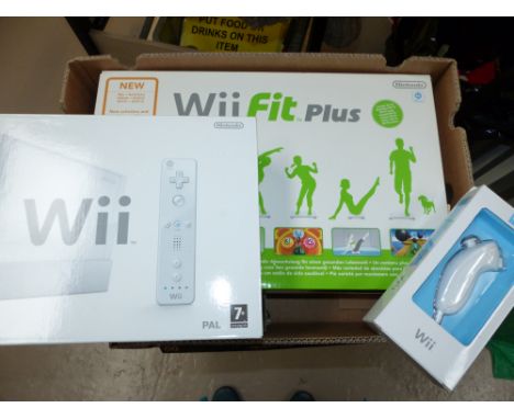 A Wii console, boxed, with Wii Sports, boxed, Wii Fit Two board and other accessories