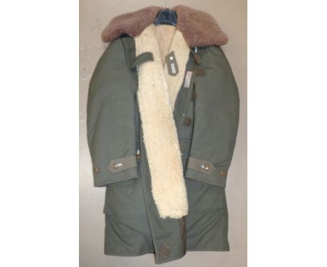 A WWII Swedish army sheepskin 3/4 length coat labelled Militar Utrustingar