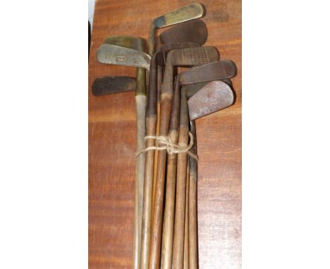 A selection of hickory shafted vintage golf clubs including 2 putters with brass heads