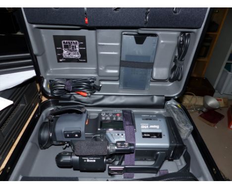 An original VHS video recorder with accessories and case