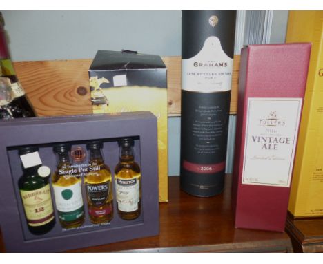 A bottle of Graham's late bottled vintage port; a bottle of Fullers vintage ale 2016; a boxed set of 4 whiskey miniatures and