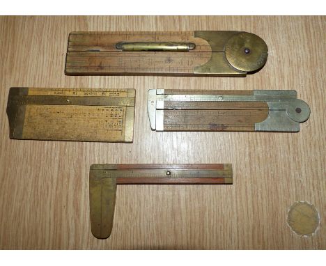 A 19th century carpenter's 9'' folding rule with integral calliper scale, 3 similar rulers