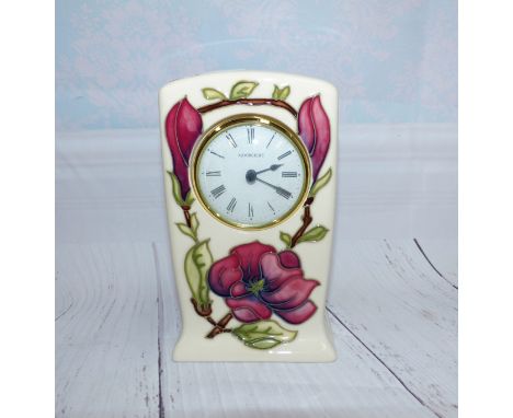 A Moorcroft mantel clock with anemones against a white ground, impressed monogrammed and No 75 / 94, height 6"