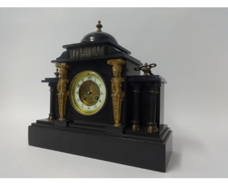 A Victorian slate cased mantle clock.