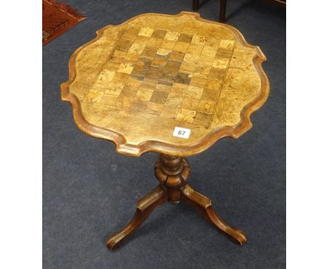 A 19th century mahogany tripod games table.