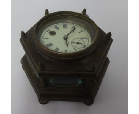 An old brass cased table clock, with key, diameter 23cm