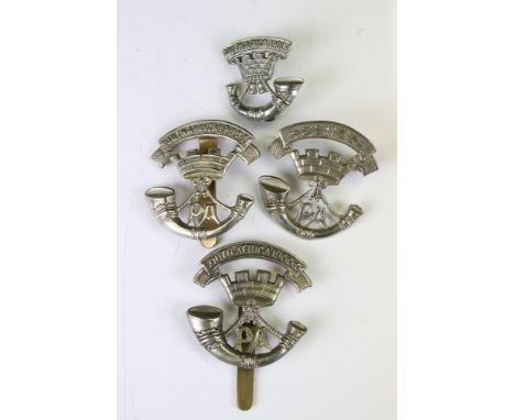 A Collection Of Four Somerset Light Infantry Regiment White Metal Cap Badges, To Include South Africa Examples, All Complete 