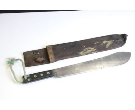 A British Military Issued World War Two Machete Knife Complete With Original Leather Scabbard, The Blade Dated 1943 And Marke